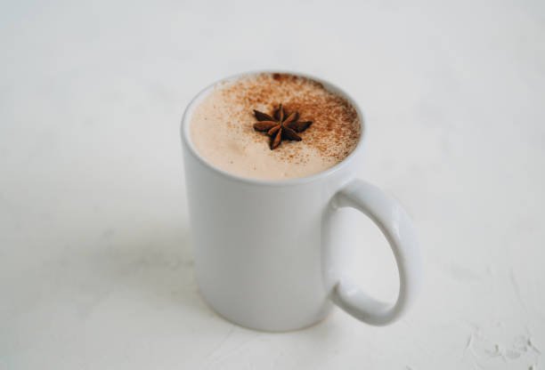 A cup of Hot latte tea on white background